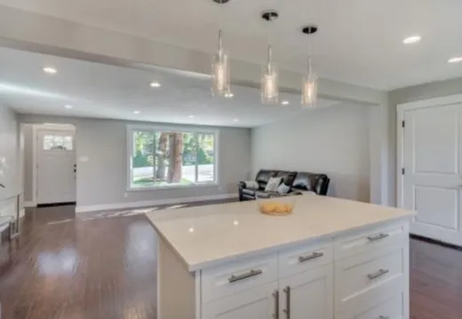 Finished basement living room with clean trim and flooring