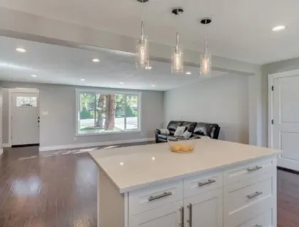 Finished basement living room with clean trim and flooring