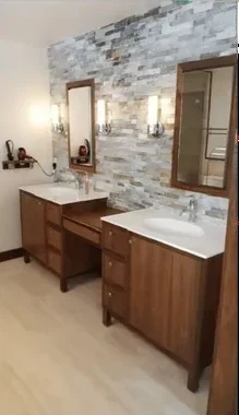 Walnut double vanity with stacked stone accent wall