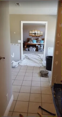 Bathroom during demolition with subfloor exposed