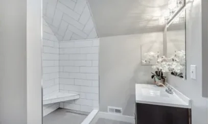Remodeled bathroom with subway tile steam shower and vanity
